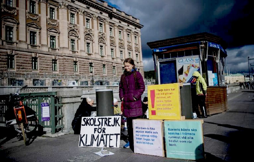 Swedish parliament buildings with Greta Thunberg