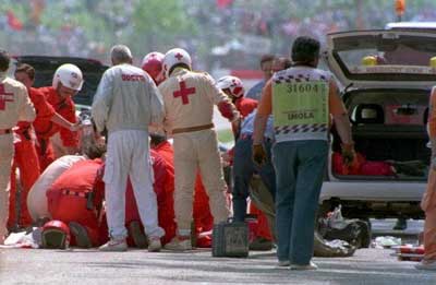 Ayrton Senna is attended to by medics after crashing in the San Marino Grand Prix in 1994