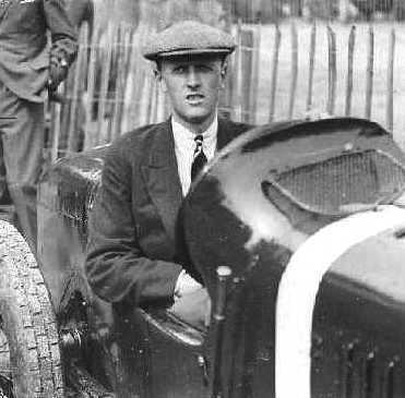 Henry Segrave sitting in his racing car