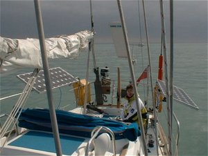 The solar panels (photovoltaic arrays) on this small yacht at sea can charge the 12 V batteries at up to 9 Amps in full, direct sunlight.